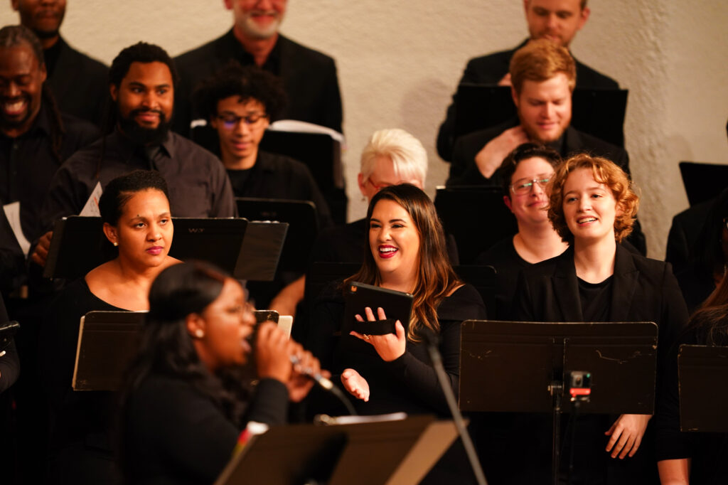 Choral ensemble singers performing during the premiere of "The Canon for Racial Reconciliation."