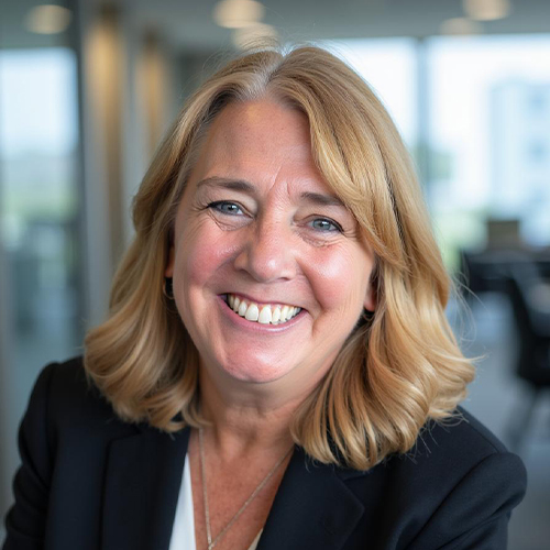 Headshot of Dr. Kelli Schutte, Vice President for Graduate and Innovative Programs at William Jewell College, smiling in a dark blazer in an office setting.