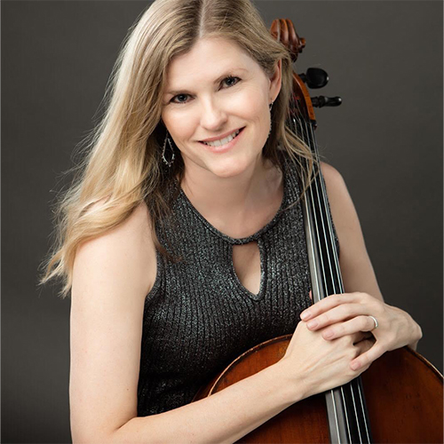 Headshot of Dana Woolard, Adjunct Instructor in Music - Cello at William Jewell College, holding a cello against a dark backdrop.