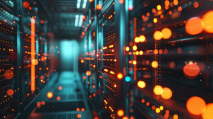Abstract view of server racks illuminated with orange and blue indicator lights.
