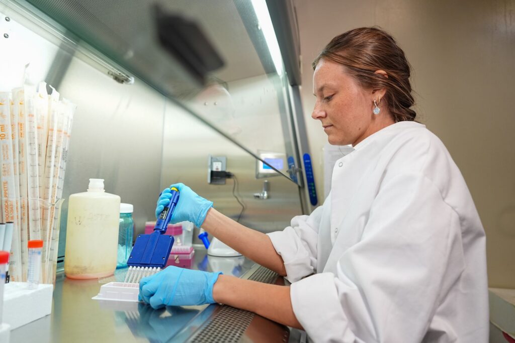 Student conducts biology experiment.