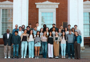 A large group of Christian Fellows students posing together on the steps outside Jewell Hall.
