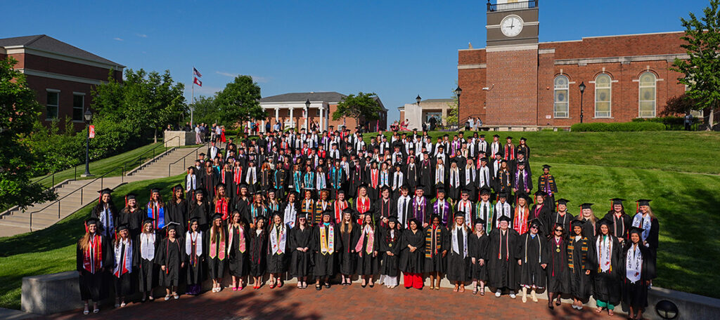group picture of Class of 2026 in caps and gowns