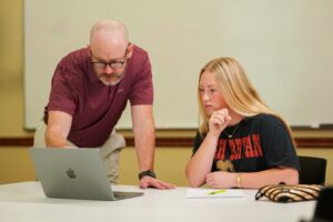 Accounting student gets help from professor