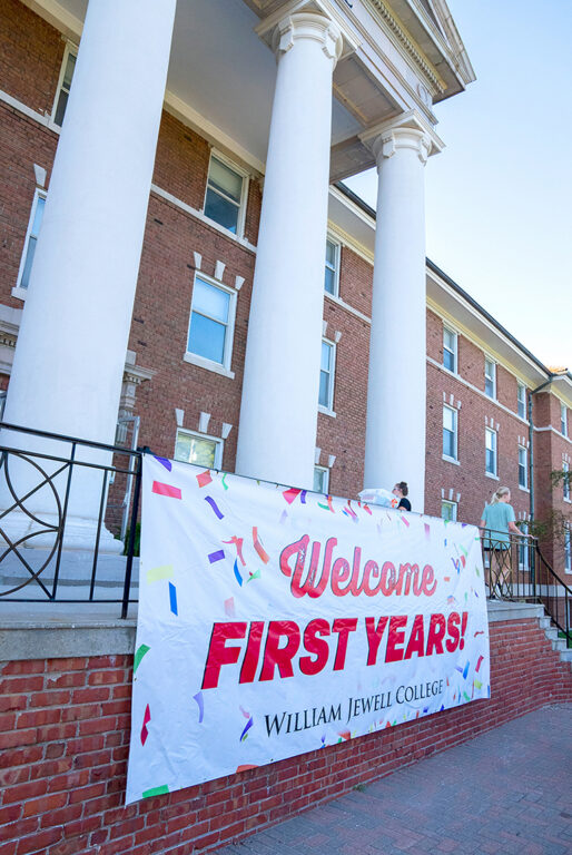 Mathes Hall dorm entrance with banner, WELCOME FIRST YEARS