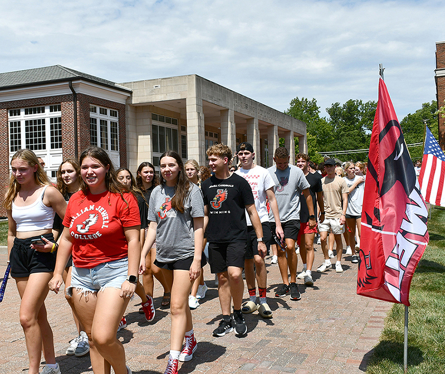 new students walking in line around quad for first day ceremony
