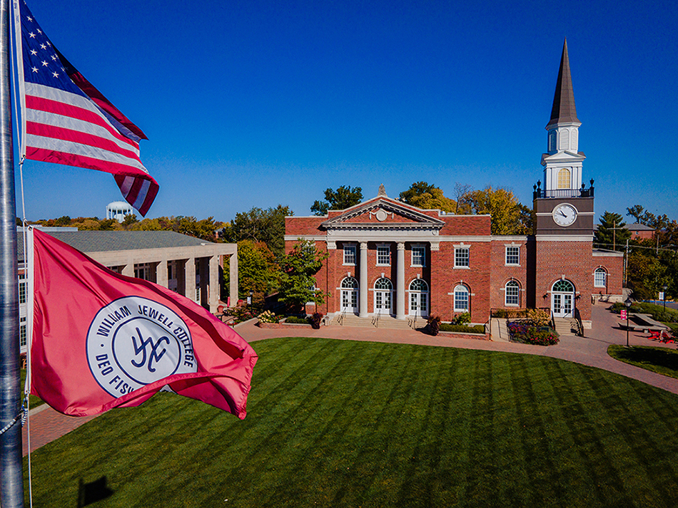 aerial of campus buildings with Jewell, American flags flying