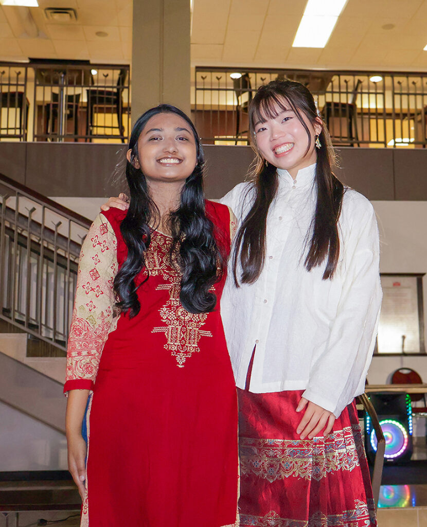 students dressed in Asian attire for cultural fashion show
