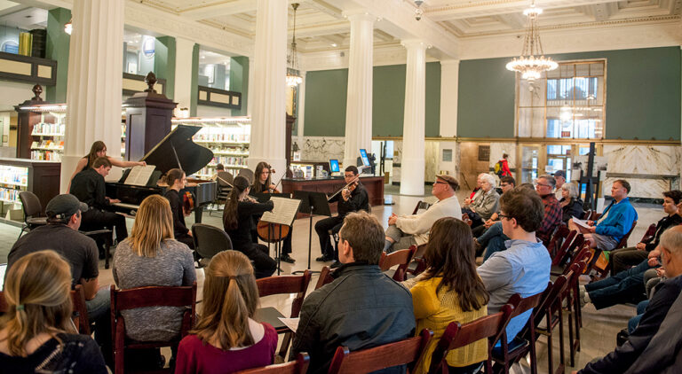 small orchestra playing in public library atrium