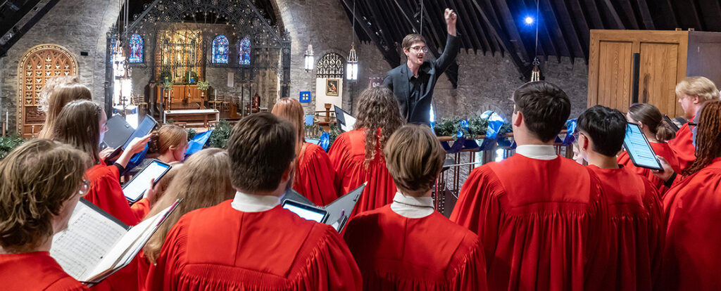 Choir director conducting choir in cathedral