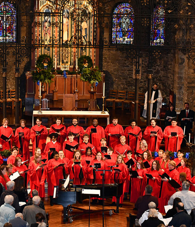 choir in robes singing in KC Cathedral