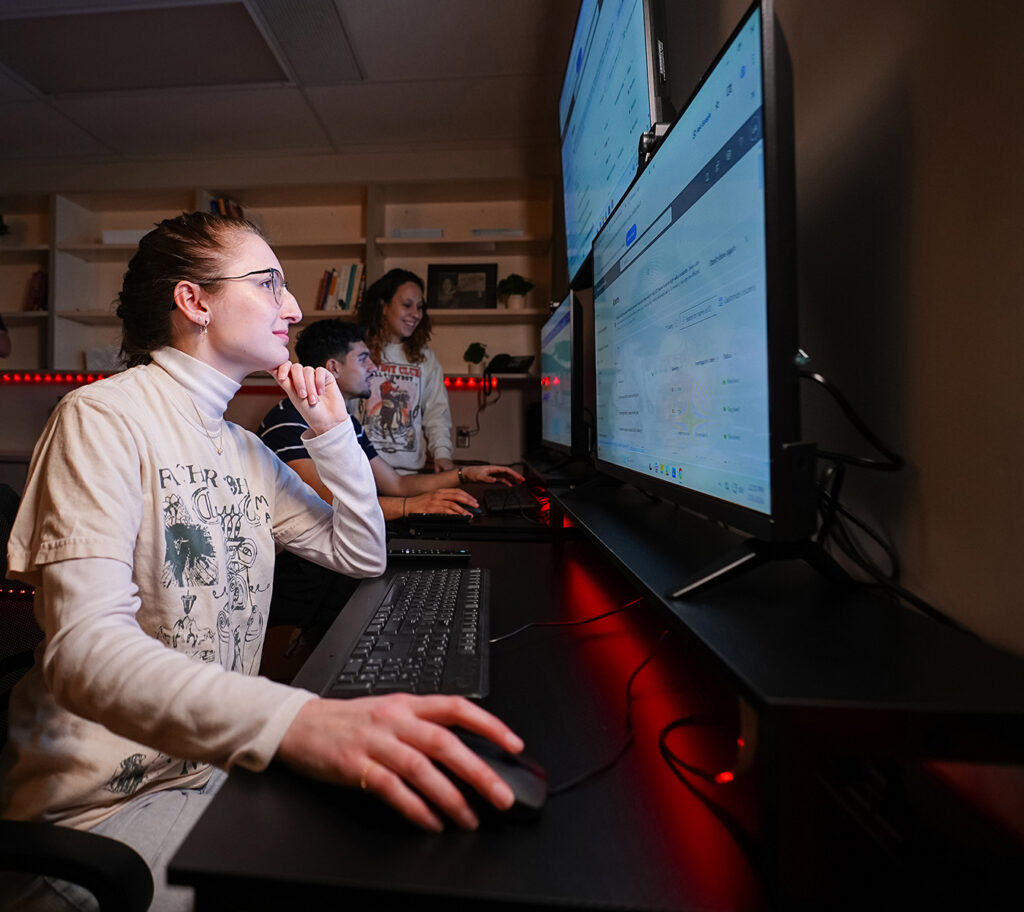 cyber students viewing monitors in campus security center
