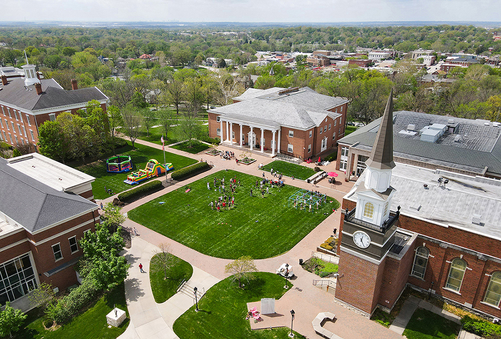 aerial of campus quad with students outside playing games
