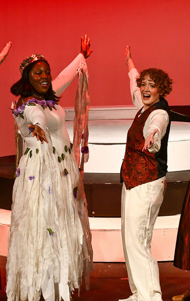 2 people in costume on stage singing in Orpheus opera production
