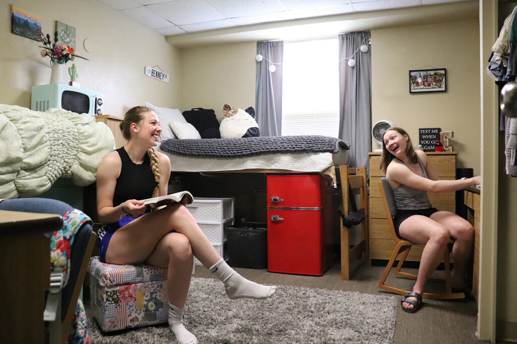2 women talking in dorm room